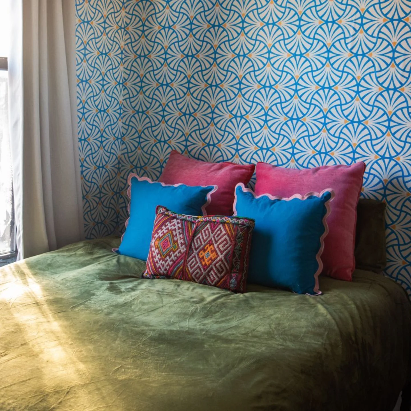 Blue scallop print wallpaper in bedroom