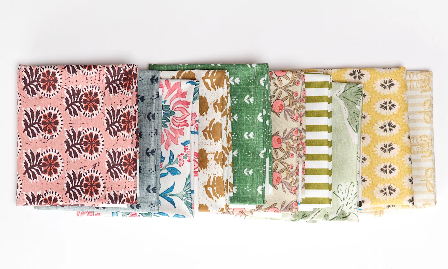 Colorful folded Spoonflower fabric with a block printed floral theme