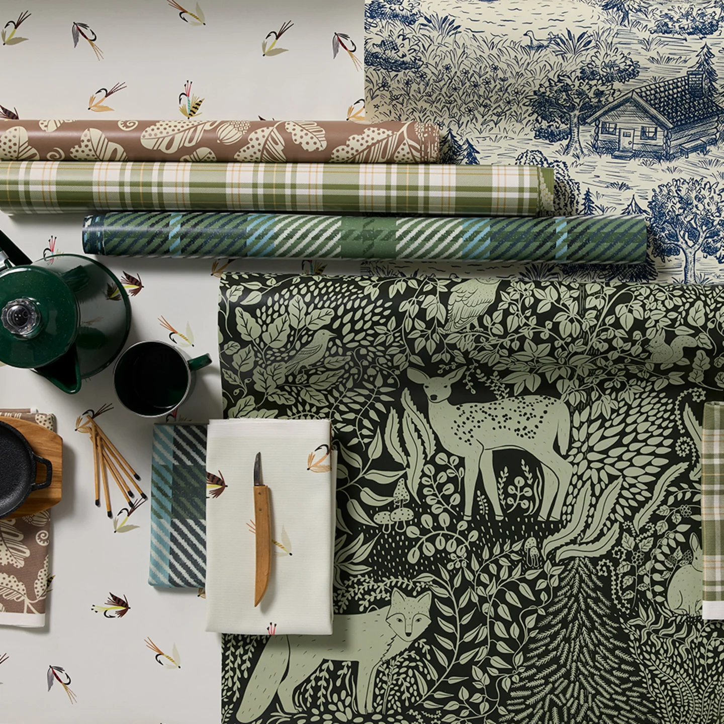 Rolls of cabincore style wallpaper.