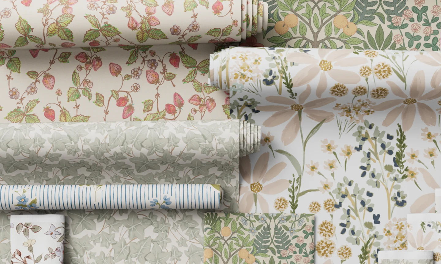 Cottagecore wallpaper rolls styled together.
