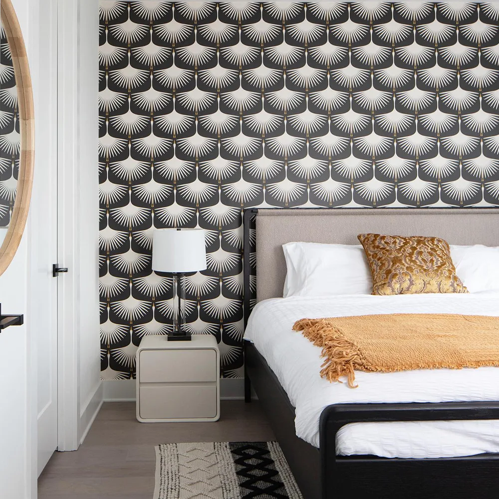 Art deco swan wallpaper in a bedroom.