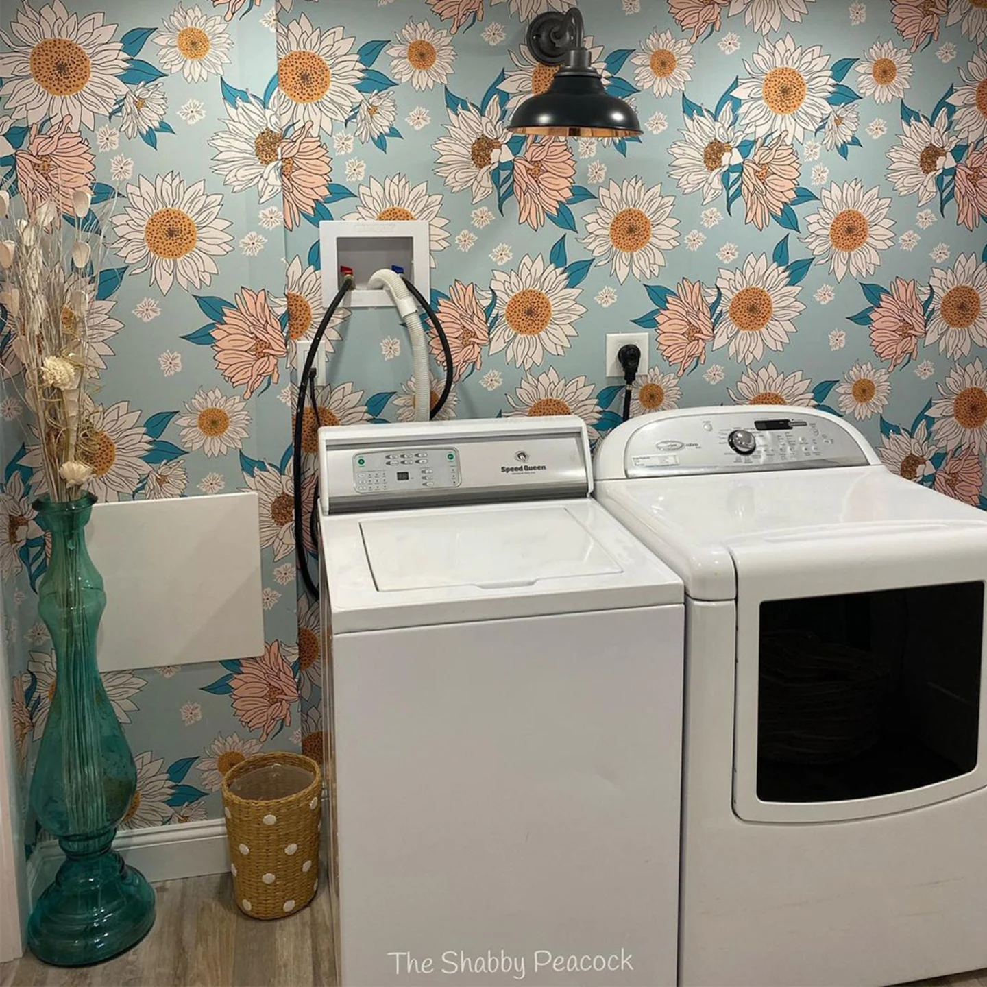 Laundry room with blue floral wallpaper