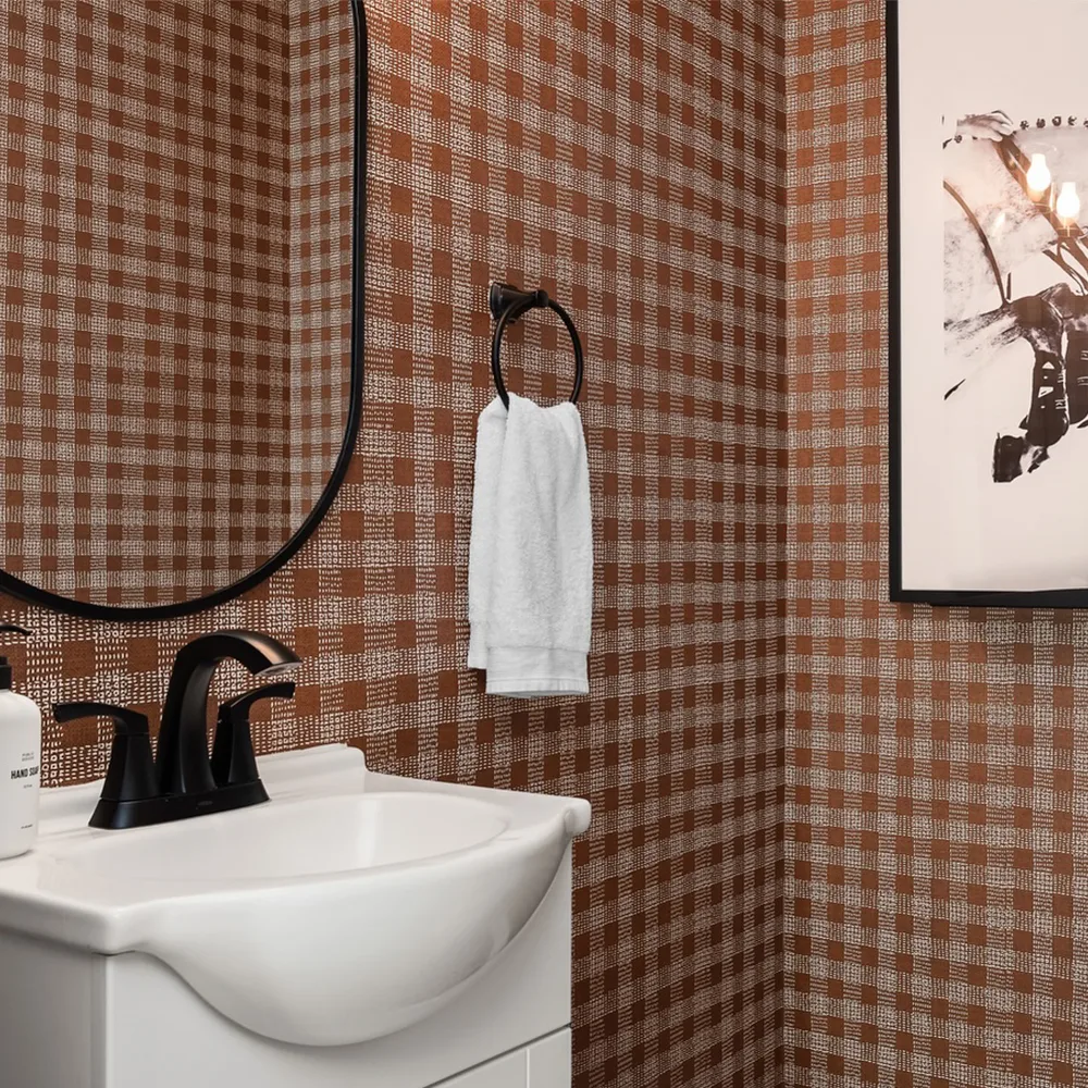 Bathroom with rustic gingham wallpaper and horse art.