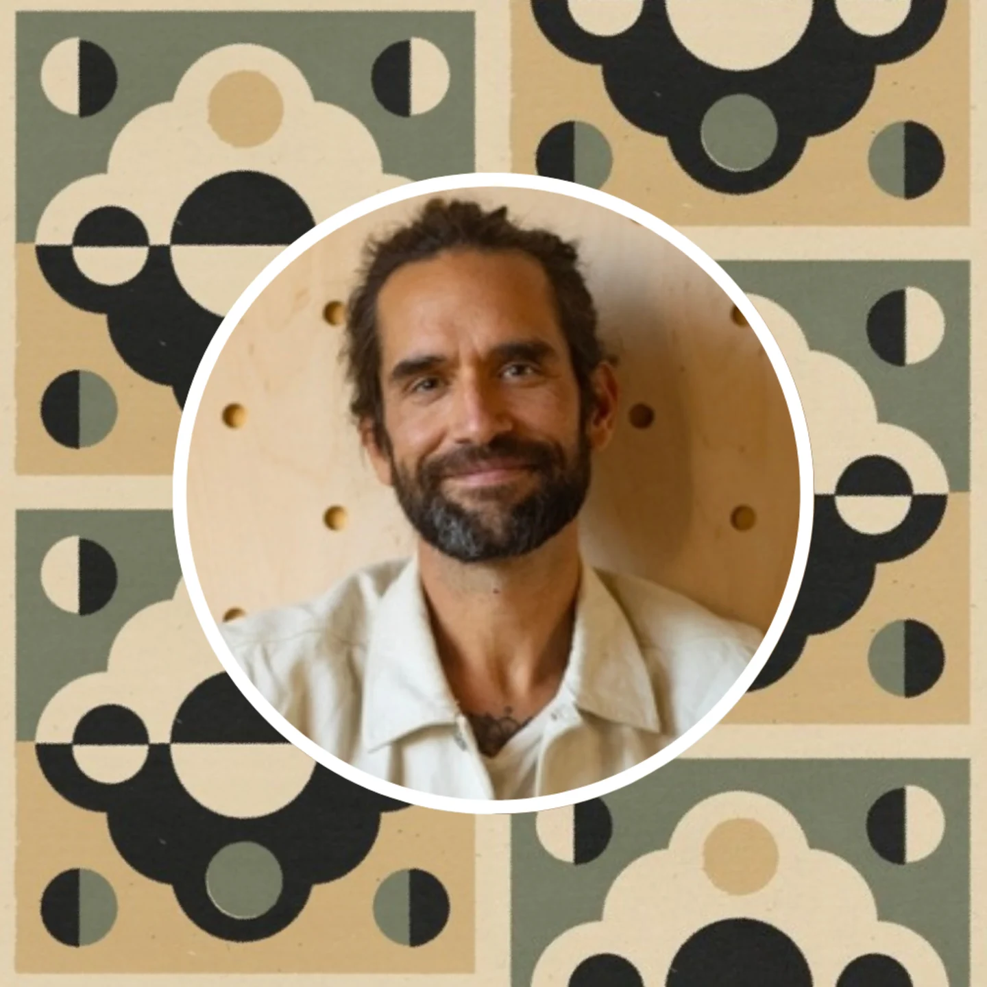 Headshot of Daren Magee with one of his prints in the background.